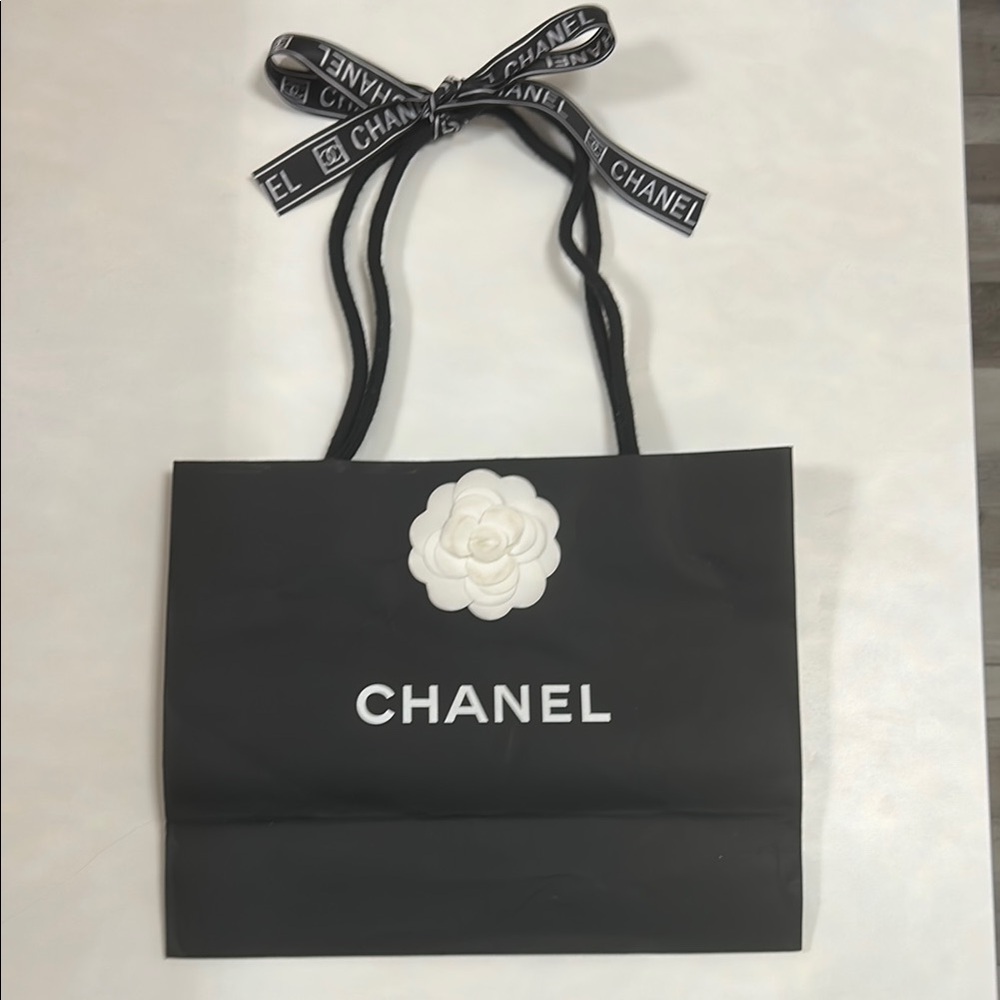 Chanel Black Tote Bag with White Flower Accent